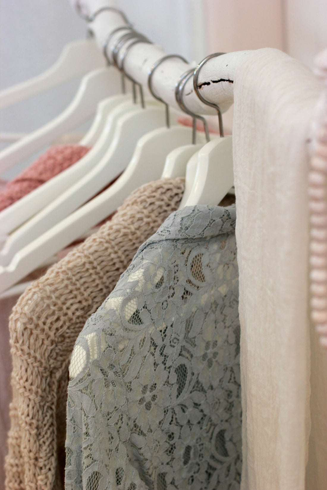 Realistic editorial lifestyle scene showing closet clips slimline hangers in active household use, practical uncluttered