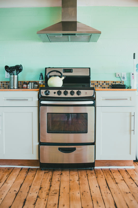 A kitchen oven range with the oven door open