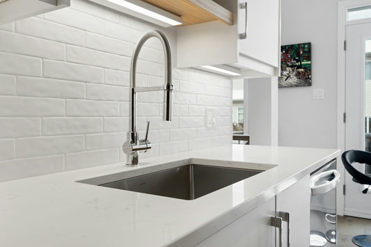 Realistic editorial lifestyle scene showing garbage disposal cleaner pods tablets in active household use, practical unc